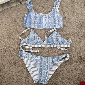 NWOT REVERSIBLE SUIT! Includes one bottom and two tops